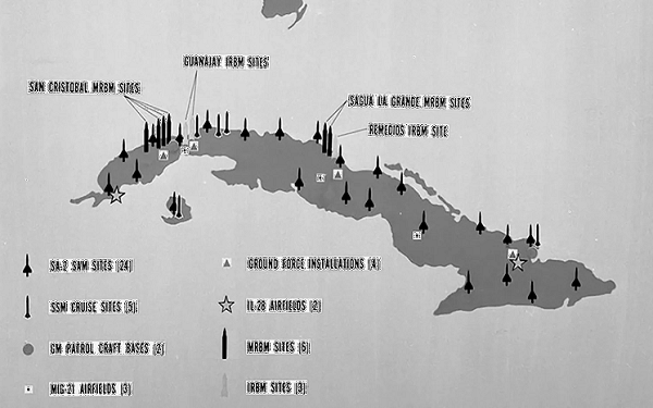 Black and white map of Cuba with scattered with missile graphics denoting missile locations on the island.